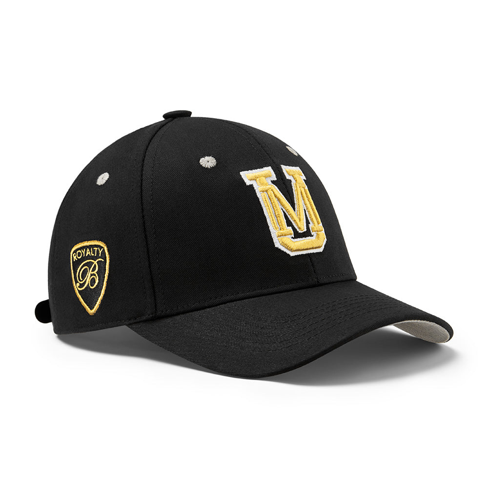 Under Manners 3D Cotton Twill Strapback Baseball Cap featuring UM monogram and Royalty-B shield logo in a stylish design.